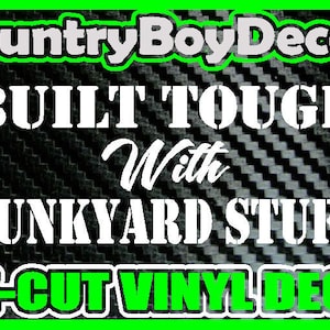 May include: White vinyl decal with the text "BUILT TOUGH With JUNKYARD STUFF" on a black and white carbon fiber background. The decal also includes the text "CountryBoyDecals" and "DIE-CUT VINYL DECAL".
