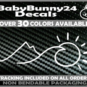 May include: White vinyl decal of a mountain range and a sun with a wave in front of it. The decal is on a black carbon fibre background. The text "BabyBunny24 Decals" and "OVER 30 COLORS AVAILABLE" is at the top of the image. The text "TRACKING INCLUDED ON ALL ORDERS! NON BENDABLE PACKAGING" is at the bottom of the image.