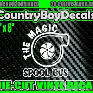 May include: A white die-cut vinyl decal with a turbocharger graphic and the text "The Magic Spool Bus". The decal is 6 inches by 6 inches and is shown on a black and white carbon fiber background.