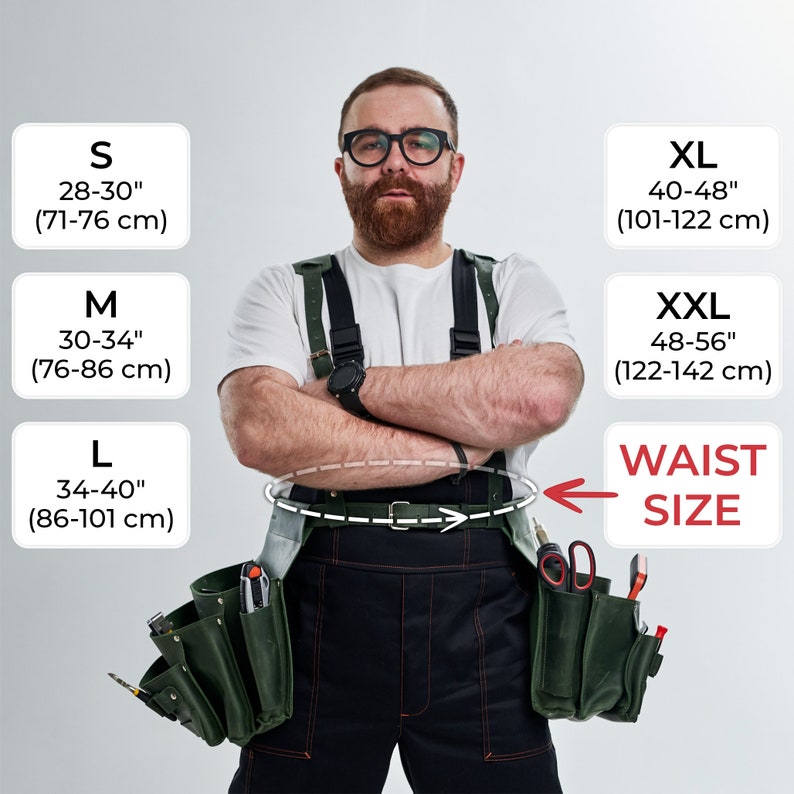 May include: A man wearing a white t-shirt and black work pants with a green tool belt. The belt has multiple pockets and is secured with a brown leather strap. The man is wearing suspenders and has his arms crossed. The image includes a size chart with measurements in inches and centimeters.