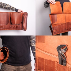 Peut inclure: Un rouleau &agrave; outils en cuir marron avec plusieurs poches et une poche zipp&eacute;e. Le rouleau est d&eacute;roul&eacute; et pos&eacute; &agrave; plat, montrant les poches int&eacute;rieures et un outil dans l'une des poches.