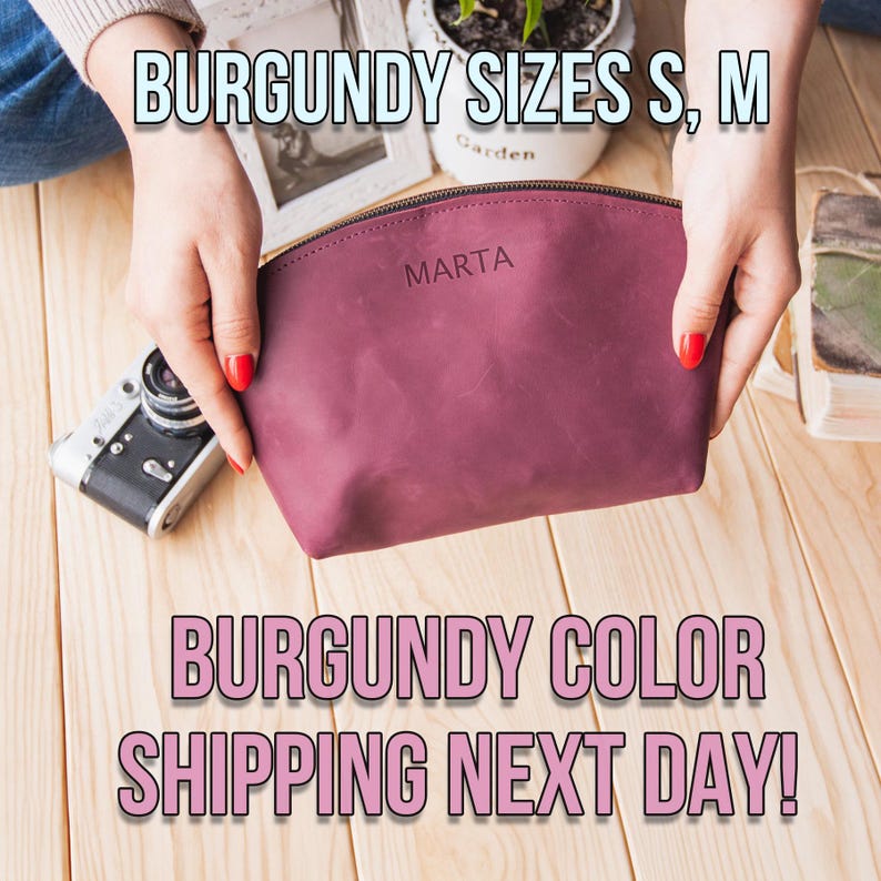 May include: Burgundy leather makeup bag with the word "MARTA" embossed on the front. The bag is being held by a person's hands. The text "BURGUNDY SIZES S, M BURGUNDY COLOR SHIPPING NEXT DAY!" is visible in the image.