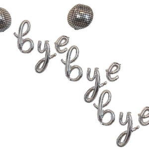 May include: Silver foil balloons spelling out "bye bye bye" with two silver disco ball balloons above the letters.