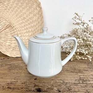 Kleine porseleinen theepot