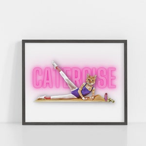 May include: A framed print of a cat wearing a leotard and leg warmers, doing a leg stretch on a yoga mat. The word "CATERCISE" is written in pink neon letters behind the cat.