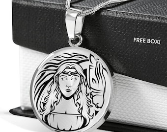 May include: A silver necklace with a round pendant featuring a black and white illustration of a woman with long hair and a horse. The pendant is engraved with a design that resembles a Celtic knot.