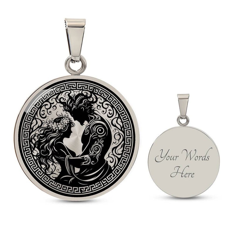 May include: A silver pendant necklace with a round, black and white image of a couple embracing. The image is surrounded by a Greek key border. The back of the pendant is plain silver with the text "Your Words Here".