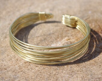 Wide multiwire classy minimal brass bronze copper wrapped wire bracelet. Bunch od wires pattern.