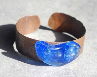 Forged wide flame painted coloured copper cuff bracelet with artistic blue glass.
