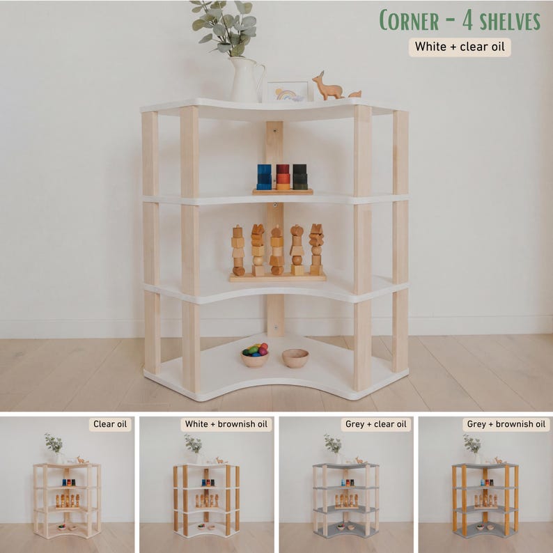 May include: A white and natural wood corner shelf unit with four shelves. The text "CORNER - 4 SHELVES" and "White + clear oil" are visible. The shelves are holding wooden toys and decorative items.