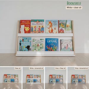 May include: A white bookshelf with a clear oil finish, filled with colorful children's books. The bookshelf has two shelves and a light wood frame. The text "BOOKSHELF" and "White + clear oil" are visible.