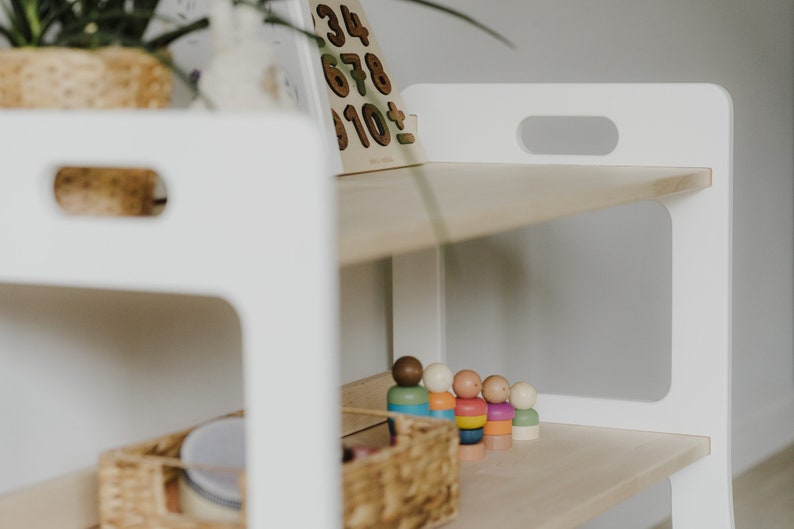 The Montessori shelf is pictured close-up to show the perfect quality, the rounded corners, and the beautiful structure of natural wood
