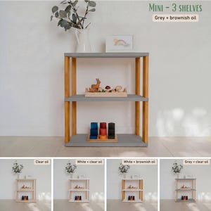 May include: A three-shelf wooden storage unit with gray shelves and natural wood supports. The text "MINI - 3 SHELVES" is at the top. The unit is displayed with toys and decorative items. Additional images show different finishes.