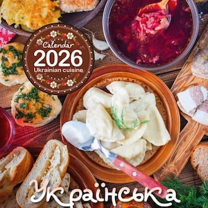 Puede incluir: Un calendario de 2026 con cocina ucraniana. La imagen muestra una variedad de platos tradicionales, incluyendo un cuenco de sopa de borscht rojo, pierogi y pan. El texto "cocina ucraniana" es visible, junto con el texto ucraniano "Українська кухня".