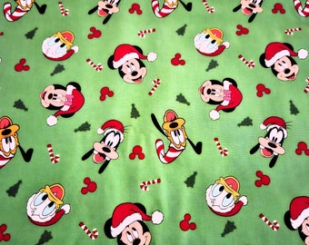Disney's Mickey Mouse Christmas fabric is priced by the yard and is 100% Cotton material