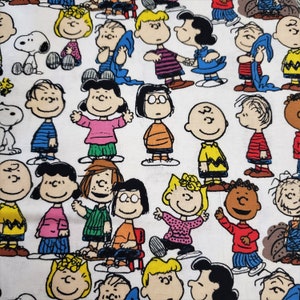 Peanuts characters material is sold by the yard and is 100% cotton fabric