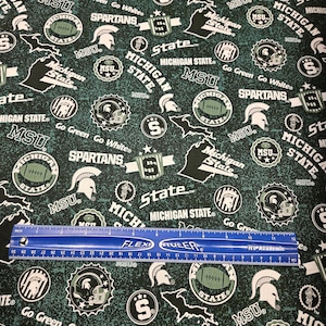 Michigan State University Spartans Football fabric by the yard and is 100% cotton
