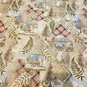 May include: A fabric featuring a repeating pattern of cabins, pine trees, deer silhouettes, fern leaves, and geometric diamond shapes in shades of beige, brown, white, and muted blue, interspersed with sections of a red and white plaid design.