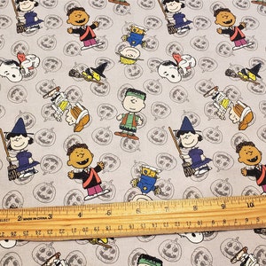 Peanuts Halloween material by the yard and is 100% cotton