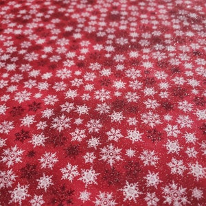 Christmas Glitter Stars snowflake material is sold by the Yard and is 100% cotton