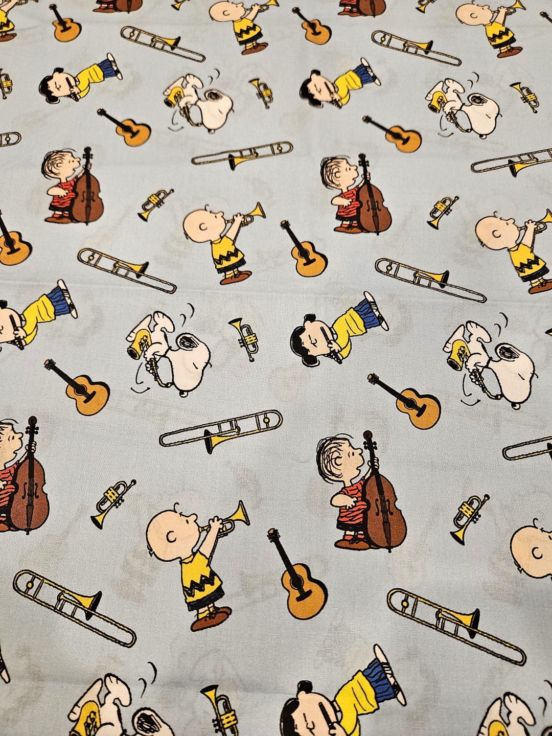 Peanuts Instrument Peanuts Characters Fabric, Musical Instruments on Light Blue Background ...