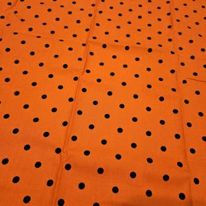 Halloween Orange with Black polka dots Halloween material by the yard and is 100% cotton