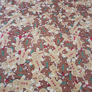 Gingerbread men Sparkle Material by the Yard and is 100% cotton fabric with glitter