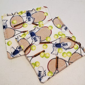 Tennis grytlappar på båda sidor, set om 2