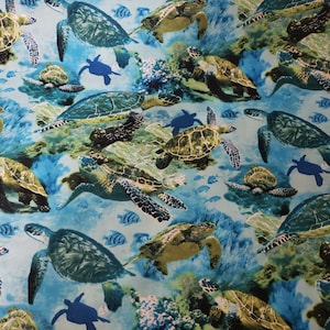 Sea Turtles Ocean Fabric is sold by the yard and is 100% cotton material