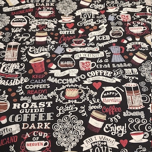May include: Black fabric with a coffee-themed design. The fabric features coffee cups, beans, and phrases like "Coffee," "Enjoy," and "Love." The design includes red, white, and brown accents.