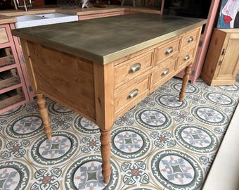 Brass topped kitchen island with breakfast bar.