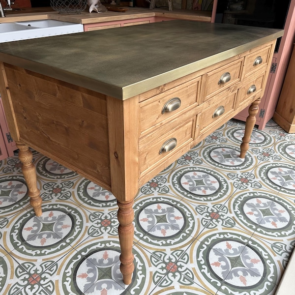 Brass topped kitchen island with breakfast bar.