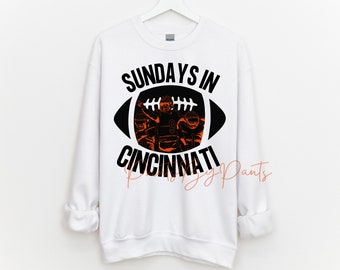 Digital Print - partial transparent football - Sundays in Cincinnati - Bengals players filled in #9, #5, #1 - PNG - Orange, black, and white