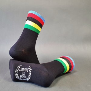 May include: A pair of black socks with colourful stripes. The socks have a white inscription that reads "Campione del Mondo".