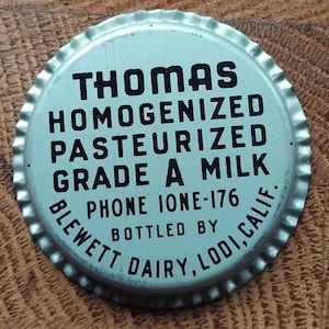 Vintage 1950 milk bottle top. Advertising.Pop art style.