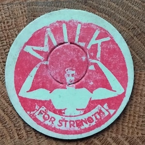 Vintage 1950 milk bottle top. Advertising.Pop art style.