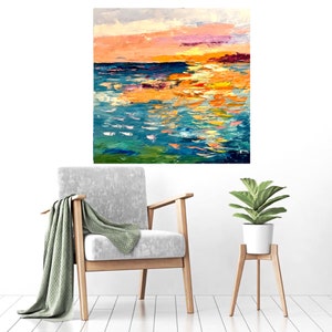 May include: Abstract painting of a sunset over a body of water. The painting is done in shades of blue, green, orange, and pink. The water is depicted with thick brushstrokes, creating a textured effect.