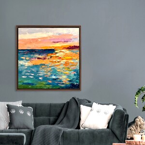 May include: Abstract painting of a seascape with a sunset sky in shades of pink, orange, and yellow. The water is painted in shades of blue, green, and white, with brushstrokes that create a textured effect.