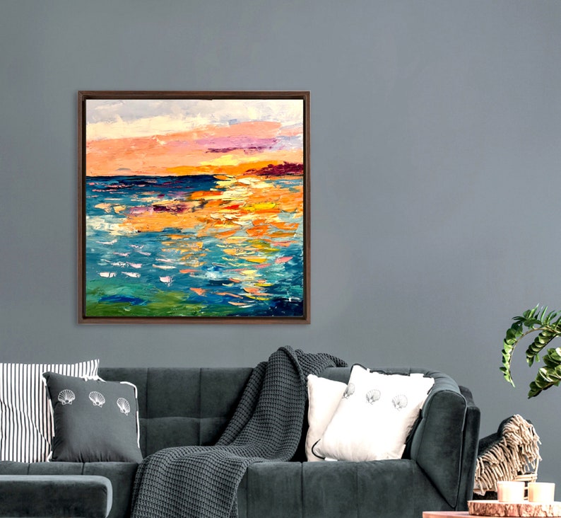 May include: Abstract painting of a seascape with a sunset sky in shades of pink, orange, and yellow. The water is painted in shades of blue, green, and white, with brushstrokes that create a textured effect.