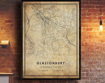 May include: A vintage style map print of Glastonbury, Connecticut. The map is in black and white and has a brown background. The text "Glastonbury, Connecticut" is at the bottom of the map, along with the coordinates "41.6862° N, 72.5451° W".