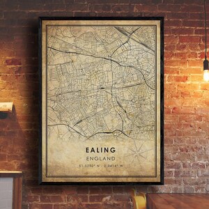 May include: A vintage style map print of Ealing, England. The map is in black and white with a beige background. The text "Ealing, England" and the coordinates "51.5250° N - 0.3414° W" are printed at the bottom of the map.