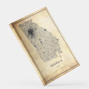 May include: A vintage-style canvas print of the state of Georgia, USA. The map is in shades of beige and gray, with the state's outline and city locations visible. The print includes the state name, country, and coordinates.