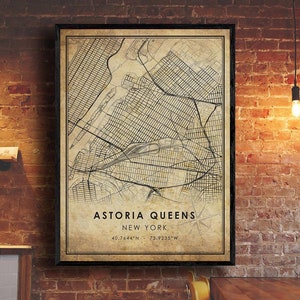 May include: A vintage-style map print of Astoria, Queens, New York City. The map is in black and white with a beige background and features street grids and landmarks. The text "Astoria Queens New York 40.7644&deg;N 73.9235&deg;W" is printed at the bottom of the map.