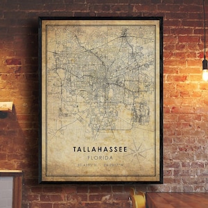 May include: A vintage-style map of Tallahassee, Florida, with a compass rose and the city's coordinates: 30.4383°N, 84.2807°W. The map is printed on a beige background with black lines and text.