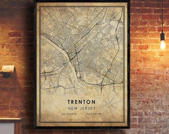May include: A vintage-style map print of Trenton, New Jersey. The map is in black and white and features a detailed street grid. The text "Trenton, New Jersey" and the coordinates "40.2206°N 74.7597°W" are printed at the bottom of the map.