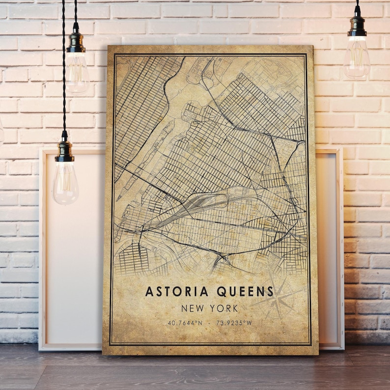 May include: A vintage-style map of Astoria, Queens, New York City. The map is printed on a beige background with black lines and text. The text at the bottom reads "Astoria Queens, New York, 40.7644&deg;N - 73.9235&deg;W".