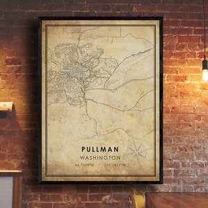 May include: A vintage style map print of Pullman, Washington. The map is in black and white with a beige background. The text "PULLMAN WASHINGTON 46.7298°N - 117.1817°W" is printed at the bottom of the map.