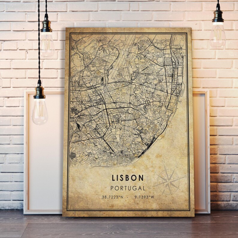 May include: A vintage-style map of Lisbon, Portugal, with a compass rose and the coordinates 38.7223&deg;N - 9.1393&deg;W. The map is printed on a beige background with black lines.
