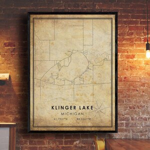 May include: A vintage-style map print of Klinger Lake in Michigan. The map is in black and white and features a compass rose and the coordinates 41.7931°N 85.5261°W.