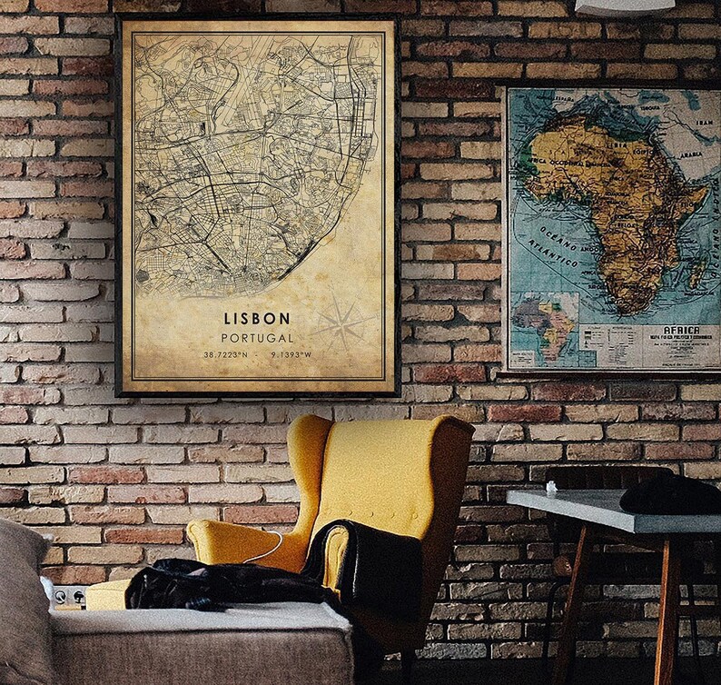 May include: A vintage-style map of Lisbon, Portugal, with a compass rose and the coordinates 38.7223&deg;N, 9.1393&deg;W. The map is printed on aged paper with a brown background and black lines.